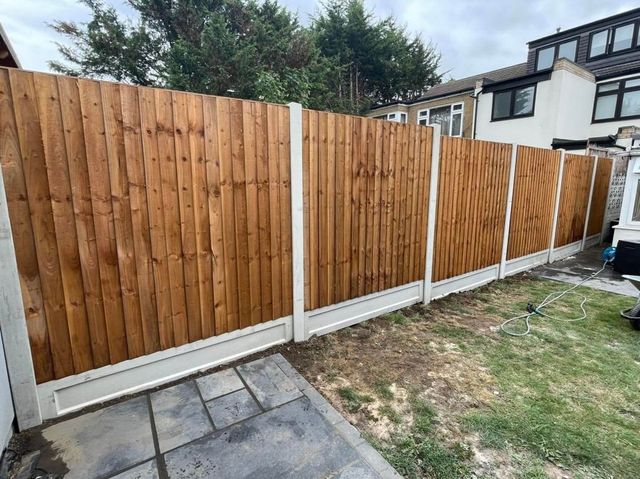 Closeboard fencing built on concrete posts and gravel boards